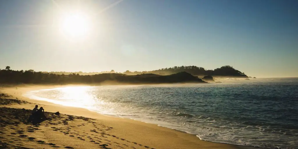 A beach with sand and water on it
