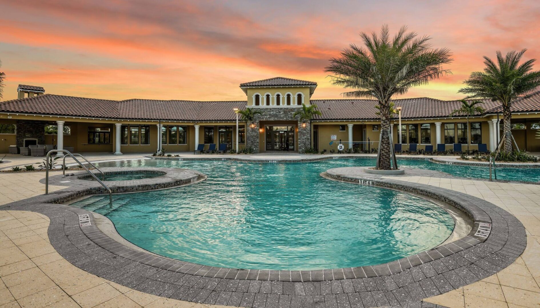 A pool with a large building in the background